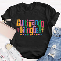 Cultivando Bilingües Bilingual Colored Heart T-shirt