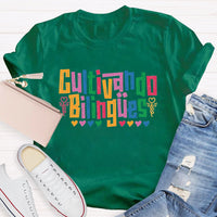 Cultivando Bilingües Bilingual Colored Heart T-shirt