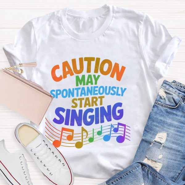 Caution May Spontaneously Start Singing Colorful Letters Teacher T-shirt