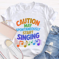 Caution May Spontaneously Start Singing Colorful Letters Teacher T-shirt
