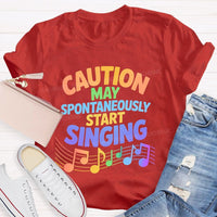 Caution May Spontaneously Start Singing Colorful Letters Teacher T-shirt