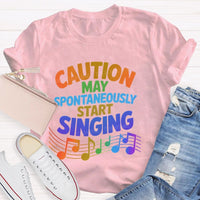 Caution May Spontaneously Start Singing Colorful Letters Teacher T-shirt