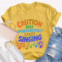 Caution May Spontaneously Start Singing Colorful Letters Teacher T-shirt