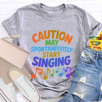 Caution May Spontaneously Start Singing Colorful Letters Teacher T-shirt