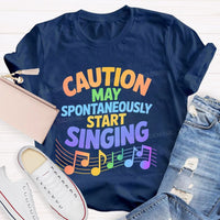 Caution May Spontaneously Start Singing Colorful Letters Teacher T-shirt