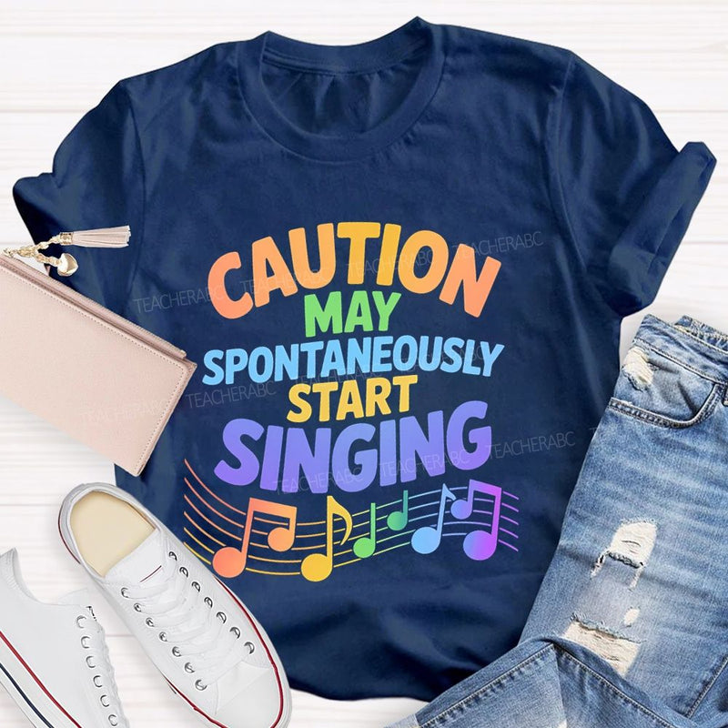 Caution May Spontaneously Start Singing Colorful Letters Teacher T-shirt