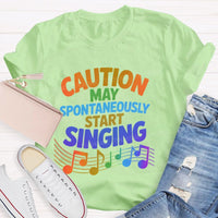 Caution May Spontaneously Start Singing Colorful Letters Teacher T-shirt