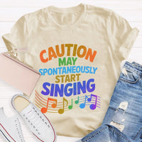Caution May Spontaneously Start Singing Colorful Letters Teacher T-shirt