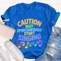 Caution May Spontaneously Start Singing Colorful Letters Teacher T-shirt